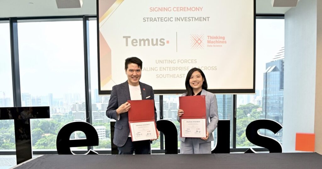 Sng Ren Yeong, CEO, Temus x Stephanie Sy, Founder, Thinking Machines Showing the Contract (2) 2 Large.jpeg