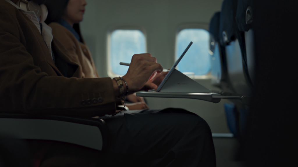 KV of a creator - professional using the tablet while in transit.png