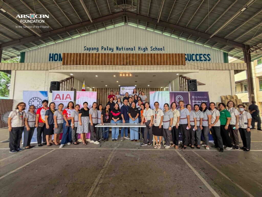 Organizers and public school teachers in a group photo at the screening venue