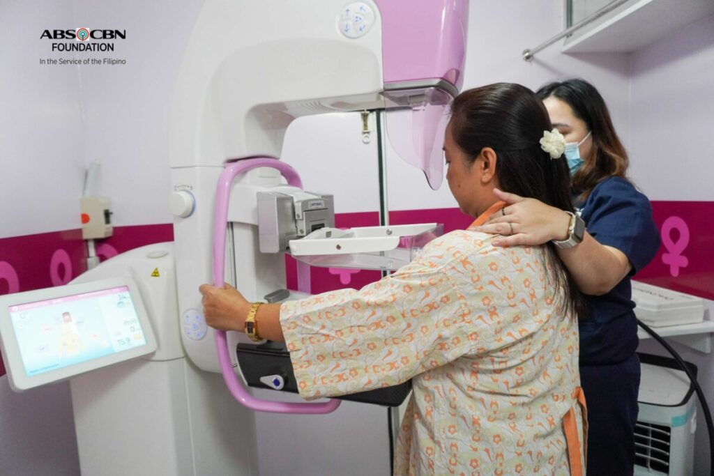 A woman undergoing a mammogram inside the Hope Mobi Clinic