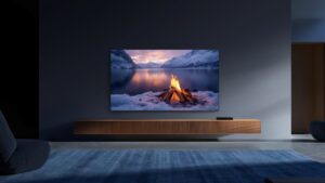 Xiaomi TV S Mini LED showing a sunset landscape in a dark living room