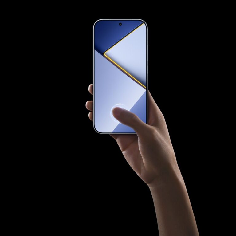 Hand holding the POCO X8s with its display facing out against a black background